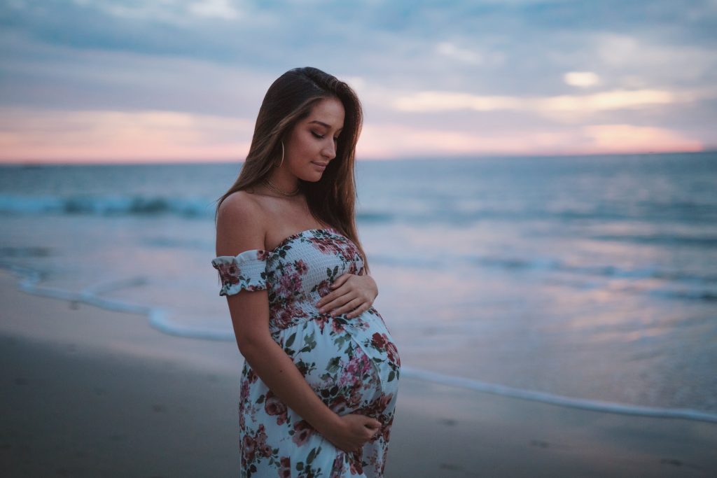 Maternity lady outdoor photoshoot on the beach